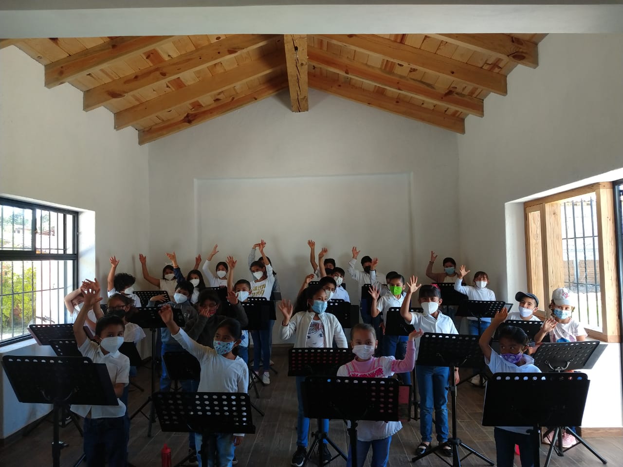 The children from Acatitlán performing an indoors activity